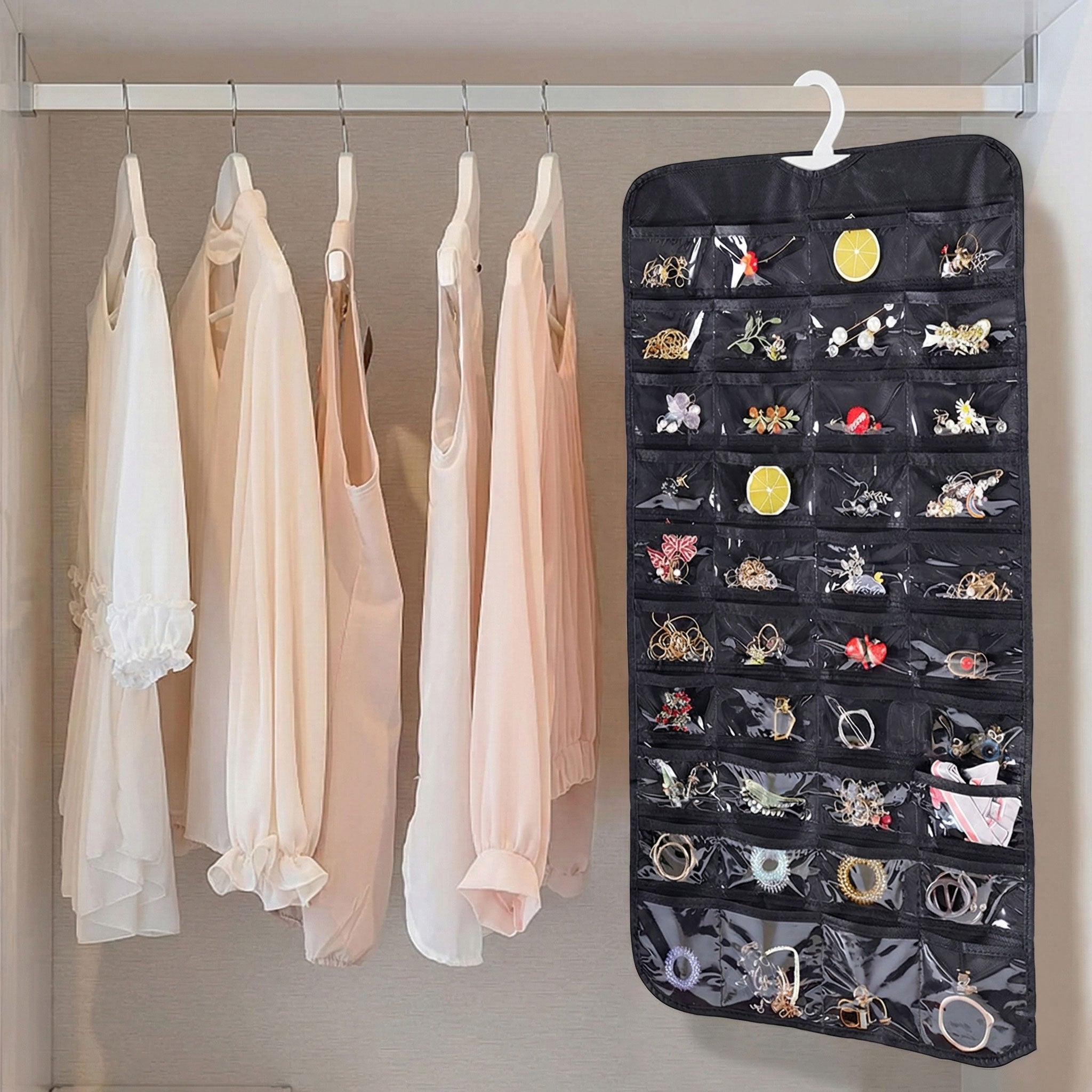 Efficient Hanging Jewelry Organizer with Embossed Pattern and 28 Clear PVC Pockets: Organize Your Jewelry in Style