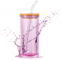 Pink tumbler with a bamboo lid and straw on a white background